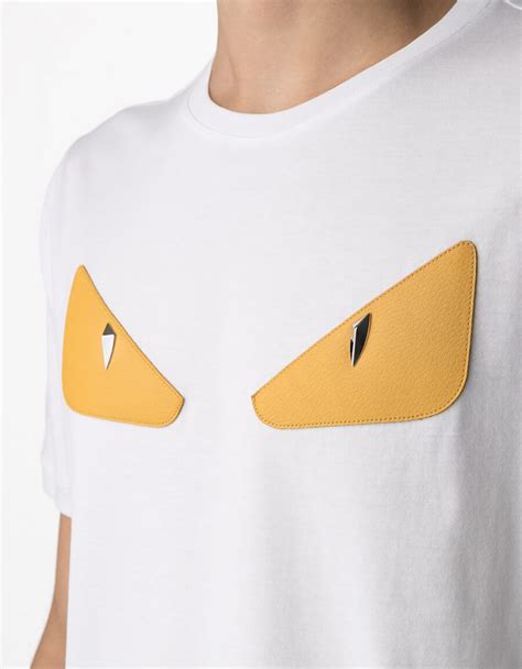 white fendi shirt with eyes on the side|Fendi fiend t shirt.